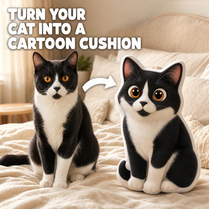 A black-and-white cat sits on a beige bed beside a large plush cat-shaped cushion, with overlaid text reading 'TURN YOUR CAT INTO A CARTOON CUSHION' and a white arrow pointing to the cushion.